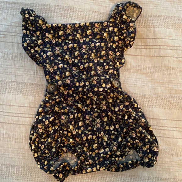12 month romper. Navy with tan floral pattern. Adjustable straps. - Picture 1 of 5